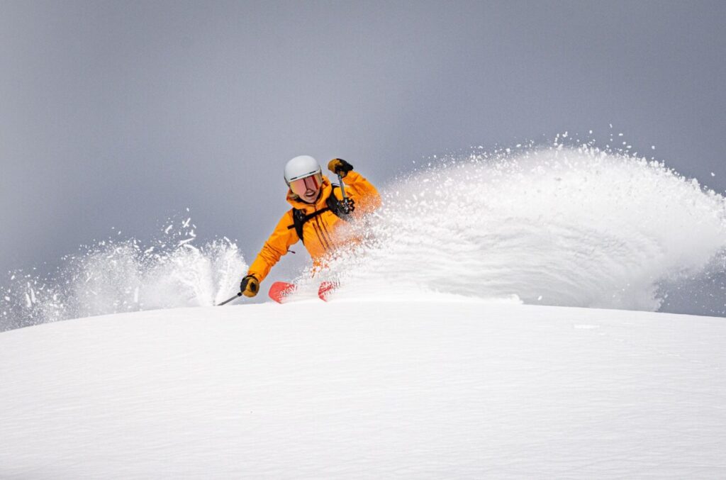 Amie Engerbretson slashing through pow